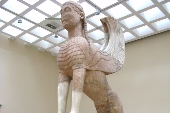 Delphi Archaeological Museum sphinx statue stop on guided small group Delphi day tour from Athens