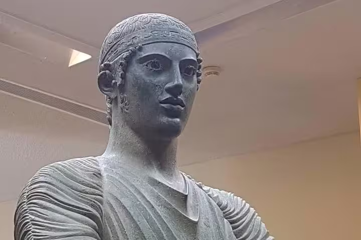 Delphi Archaeological Museum statue close-up on guided small group day tour from Athens, ancient Greek art