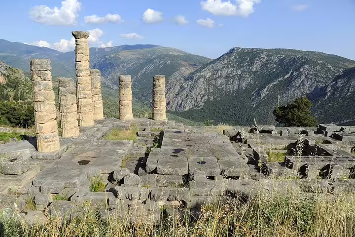 Delphi archaeological site ruins and standing columns overlooking Parnassus, on private Athens to Delphi tour