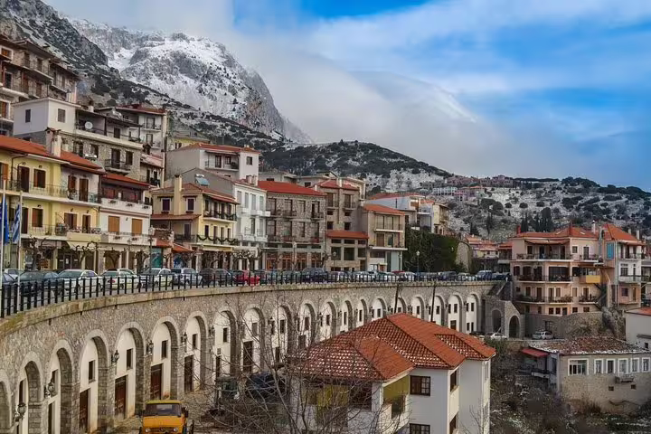 Arachova village near Delphi with snowy Parnassus views, scenic stop on private transfer from Delphi to Athens