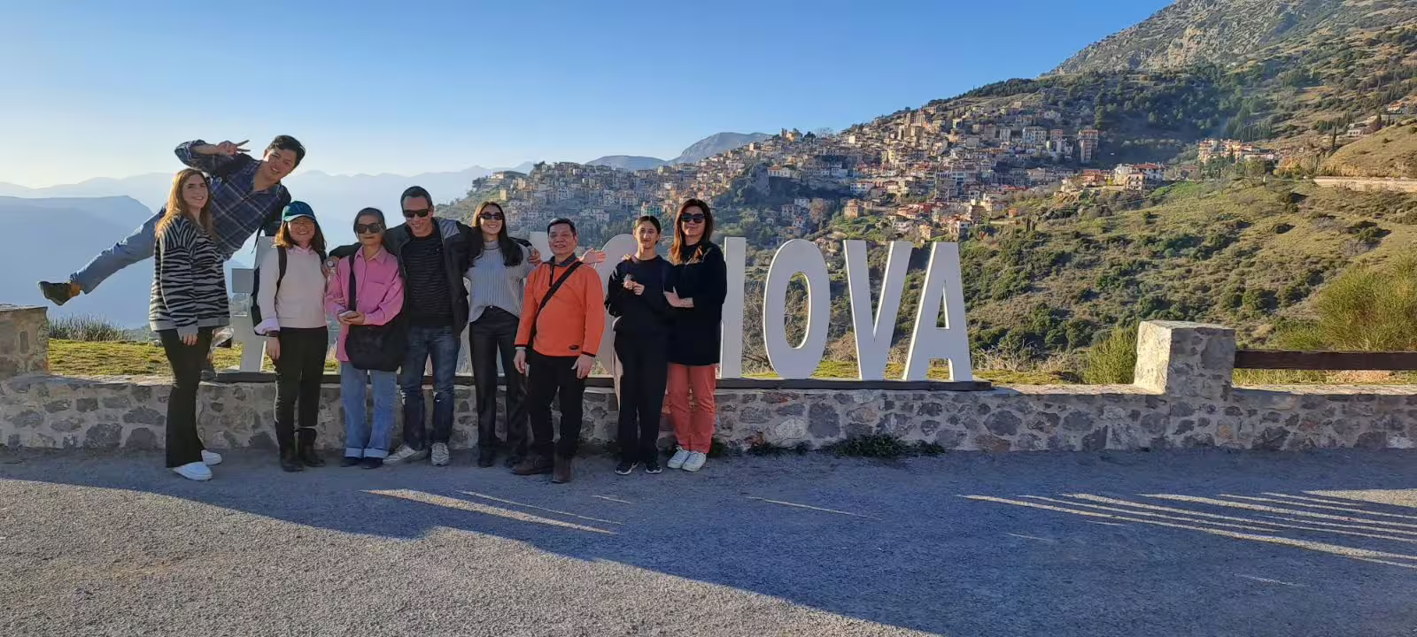 Small group Delphi day tour from Athens photo stop at Arachova viewpoint with mountain village backdrop