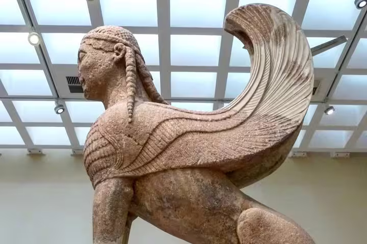 Archaic Greek sphinx statue at Delphi Museum, highlight of a Delphi full day tour from Athens