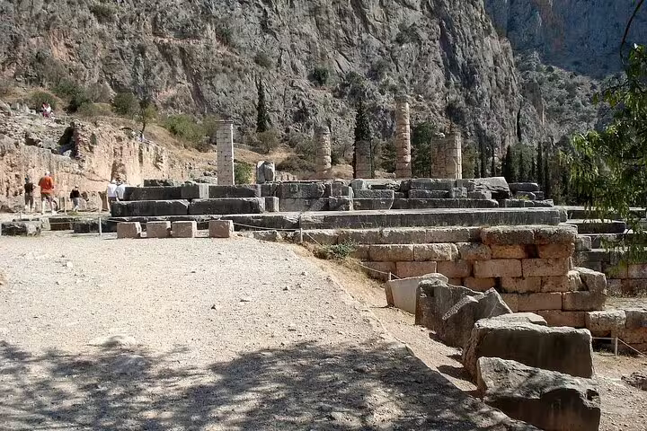 Historic ruins of Delphi with stone columns and rugged landscape, featured in Athens to Delphi and Meteora tour.