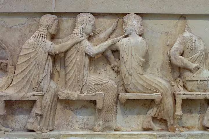 Ancient marble relief sculpture at Delphi Archaeological Museum on a private Delphi tour from Athens