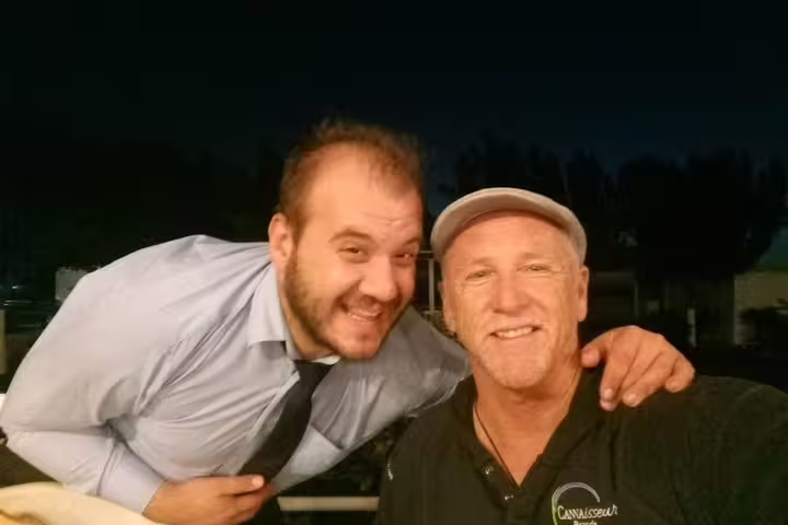 Happy guests and private driver at dinner stop on Delphi and Meteora day trip from Athens, Greece