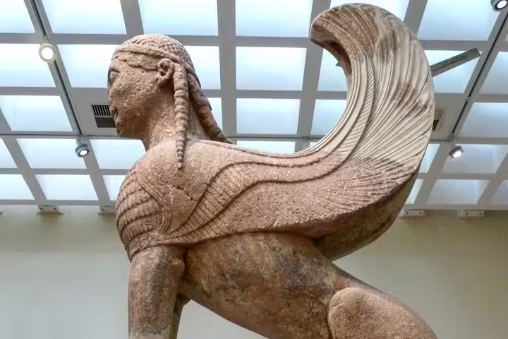 Archaic Greek sphinx statue at Delphi Museum, highlight of Delphi & Meteora 2-day tour from Athens