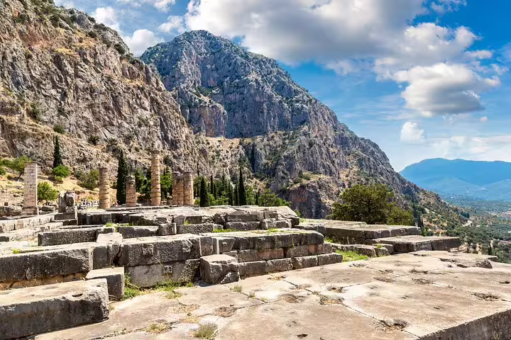 Delphi archaeological site terrace with mountain views, explored on a full-day private Oracle of Delphi tour