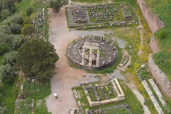 Aerial view of Delphi ruins and circular sanctuary, a highlight on a private Delphi tour from Athens