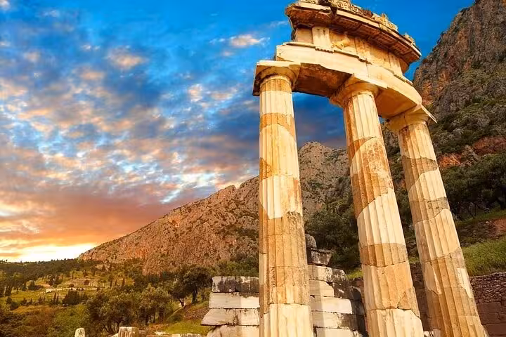 Ancient Delphi temple columns at sunset in Greece, highlight stop on Thermopylae 300 Spartans and Delphi day trip