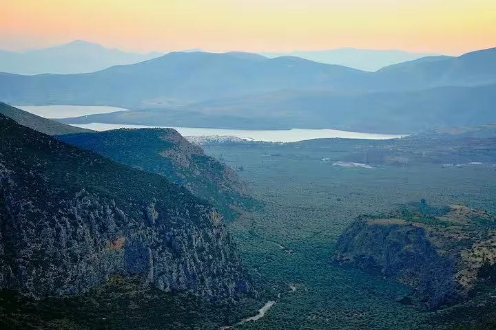 Panoramic view of Delphi valley and mountains near the ancient site, featured on a private tour from Athens