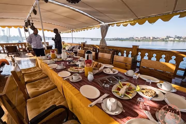 Breakfast table on deluxe Nile dahabiya sundeck, private 5 days 4 nights cruise with Abu Simbel and balloon