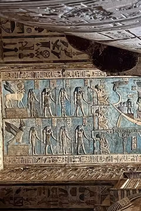 Colorful astronomical ceiling with detailed hieroglyphs at Dendera Temple, depicting ancient Egyptian cosmology.
