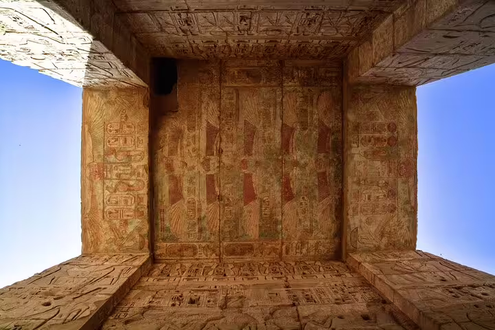 Ceiling hieroglyphs and painted reliefs in Dendera Temple sanctuary, featured on day tour to Dendera and Abydos