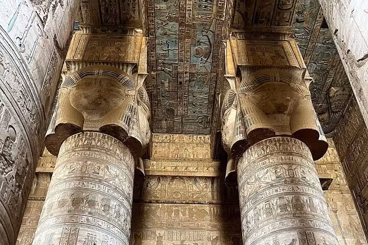 Marvel at the detailed columns and vibrant ceiling art in Dendera Temple, a highlight of the Luxor private half-day tour.