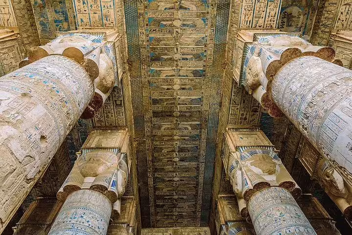 Painted ceiling and towering columns in Dendera Temple, a highlight of the Dendera and Abydos day trip