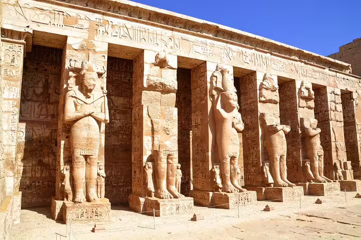 Statues and pylons at Dendera Temple courtyard, must-see stop on Dendera and Abydos temples day trip from Luxor