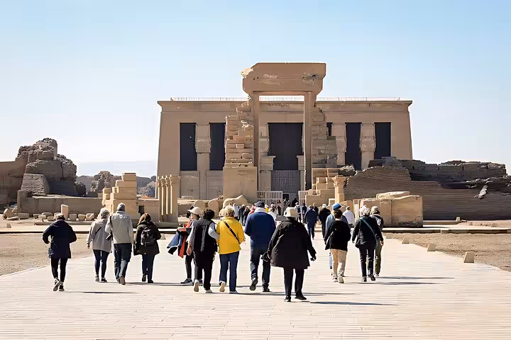 Tour group walking to Dendera Temple entrance during Dendera, Osireion and Abydos full-day trip from Hurghada