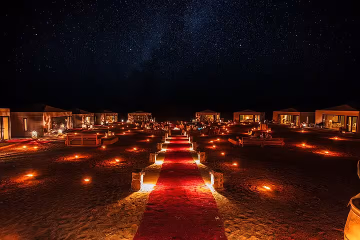 Enjoy a starlit desert camp with a red carpet under the night sky on the 3 Days Desert Tour from Marrakech to Fes.