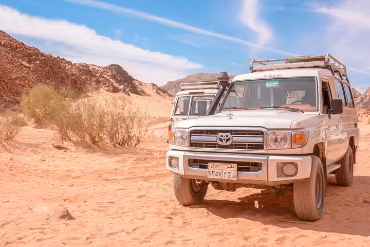 4x4 jeep in Marsa Alam desert for safari tour with camel ride and Bedouin dinner under open sky