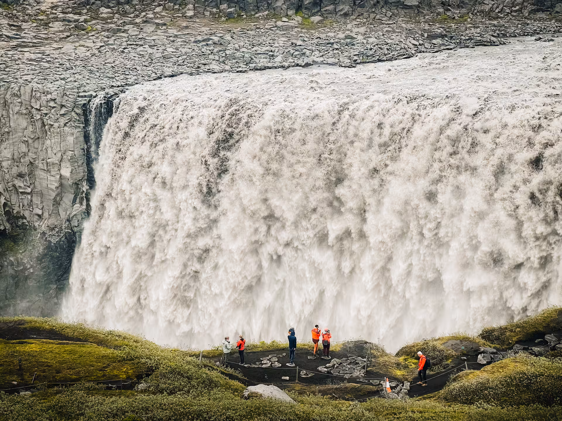 Visitors at Dettifoss viewpoint beside thundering falls, exploring North Iceland on a private Diamond Circle tour