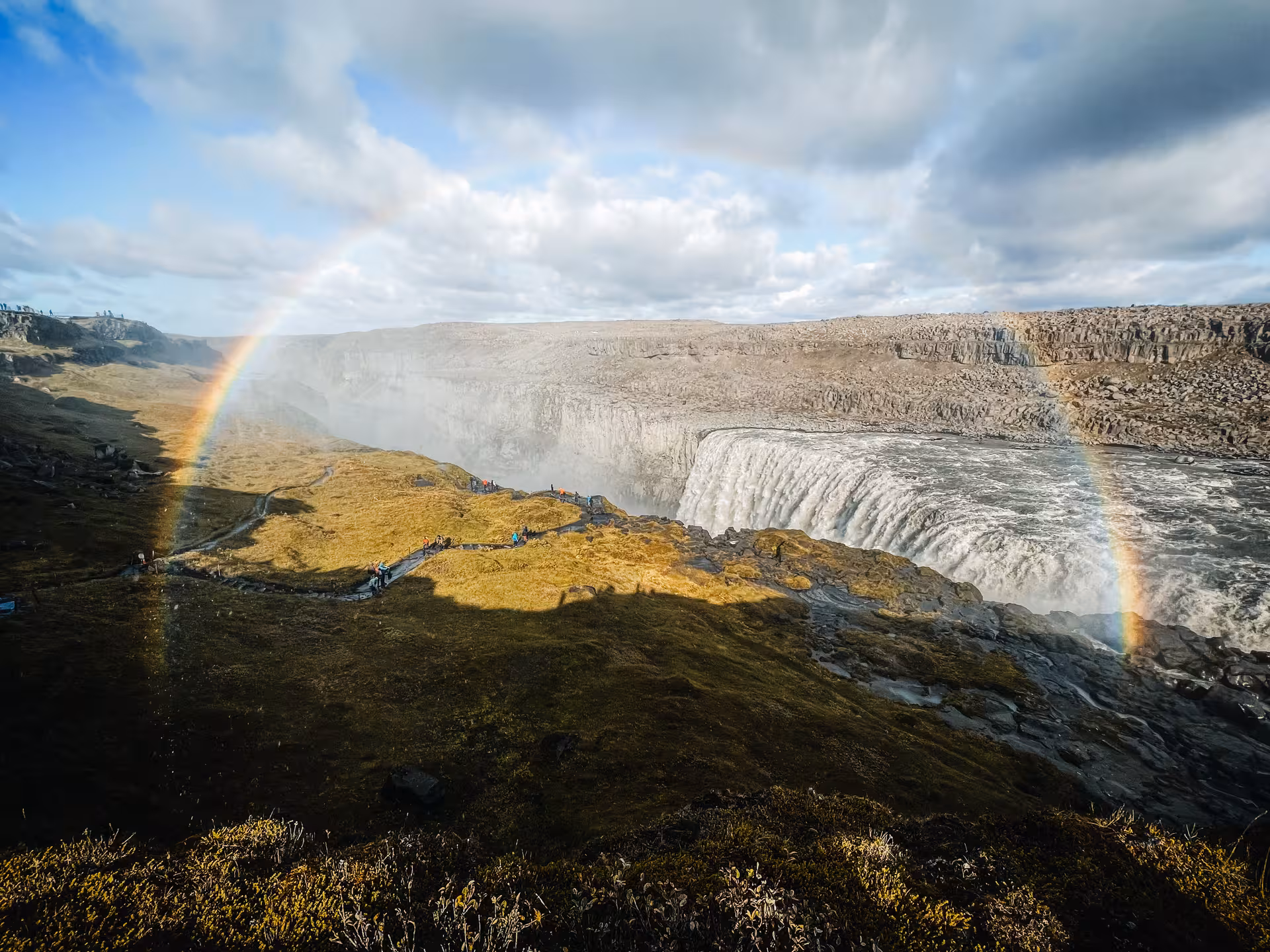 Dettifoss waterfall viewpoint with rainbow in Vatnajökull National Park on Akureyri port adventure tour