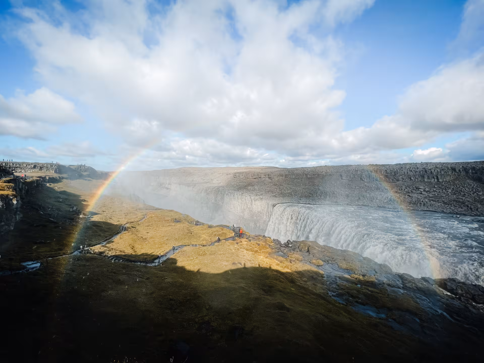 Dettifoss waterfall with rainbow over Jökulsárgljúfur canyon on a private Diamond Circle tour in Iceland