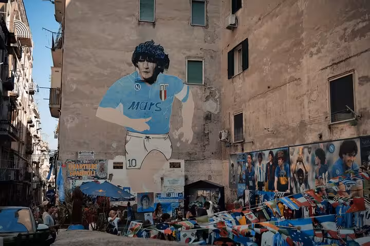 Diego Maradona mural in Naples Spanish Quarters, a highlight stop on the SSC Napoli matchday tour with a local