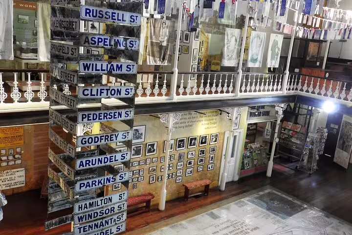 Explore historic street signs and photos at the District Six Museum, a highlight in Cape Town's vibrant township tours.