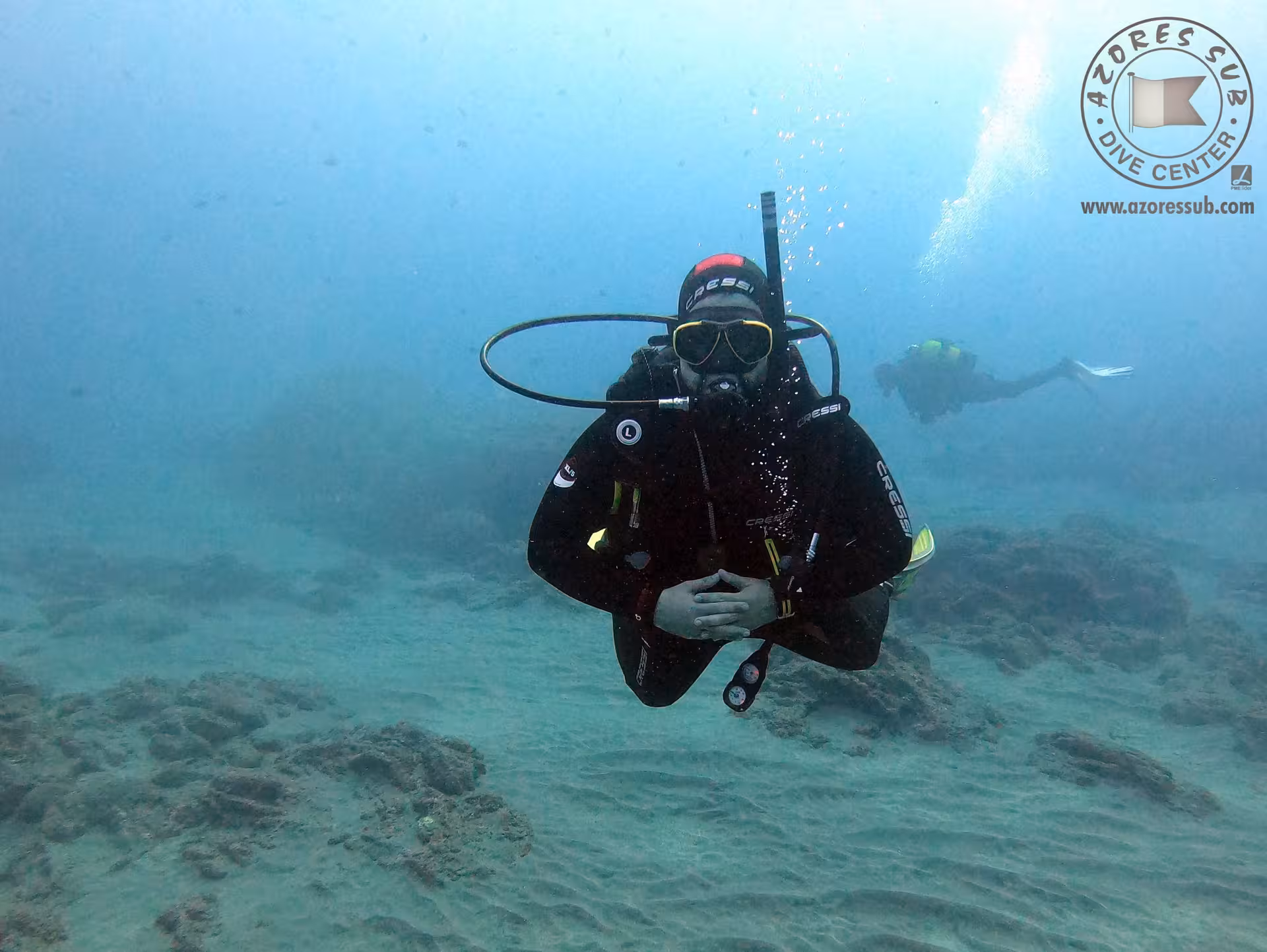 Diver hovers calmly above the seabed on a Refresh Dive, practicing core scuba skills with a professional guide