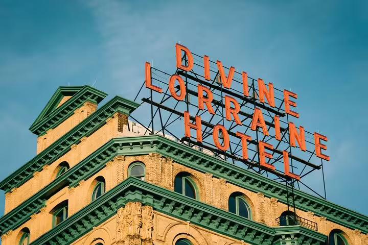 Historic Divine Lorraine Hotel rooftop sign in Philadelphia against blue sky
