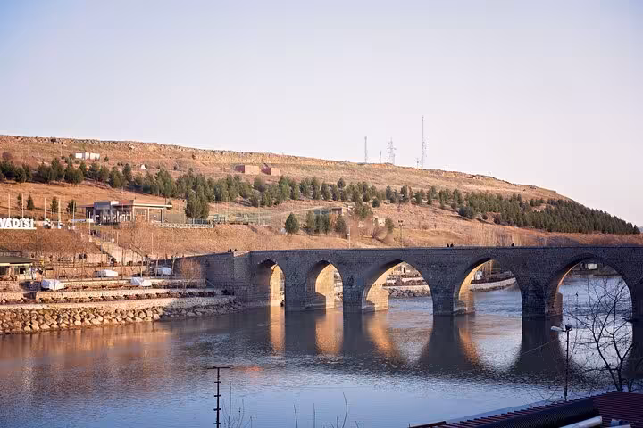 Historic stone arch bridge over the Tigris River in Diyarbakir on a private all-inclusive guided tour