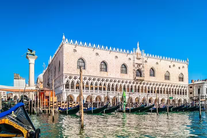 Waterfront view of Doge’s Palace and gondolas on the Grand Canal during a Venice small group tour with local guide
