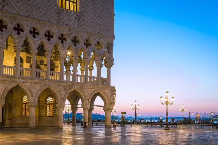 Doge’s Palace arches glowing at sunrise on St Mark’s Square in Venice, near skip-the-line access to St Mark’s Basilica tour
