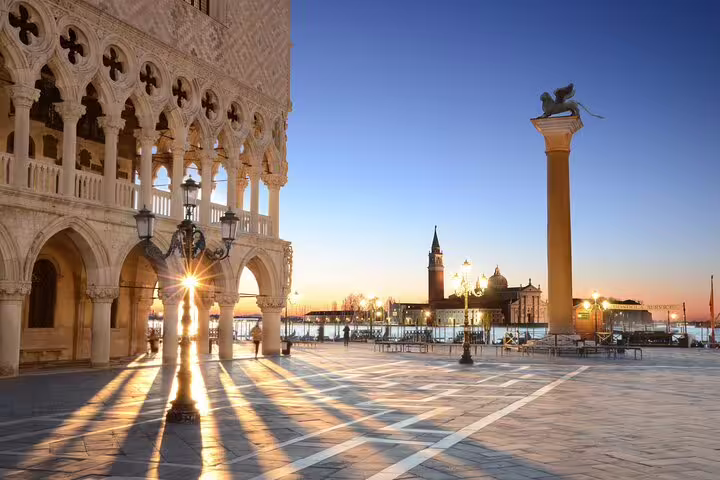 Sunrise at Doge’s Palace colonnade and St. Mark’s Square, captured during an early morning small group tour in Venice