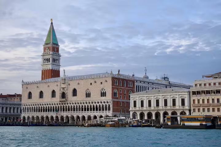 Explore the stunning façade of the Doge's Palace in Venice, Italy, with its Gothic architecture and scenic canal views.