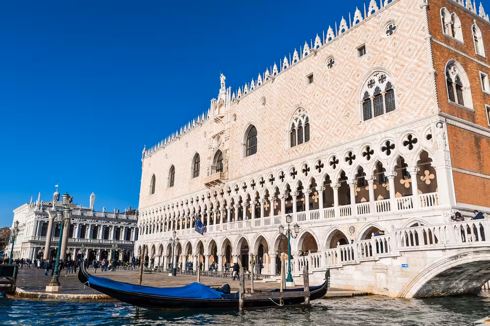 Admire the Gothic beauty of the Doge's Palace along the serene canals on our Venice walking tour adventure.