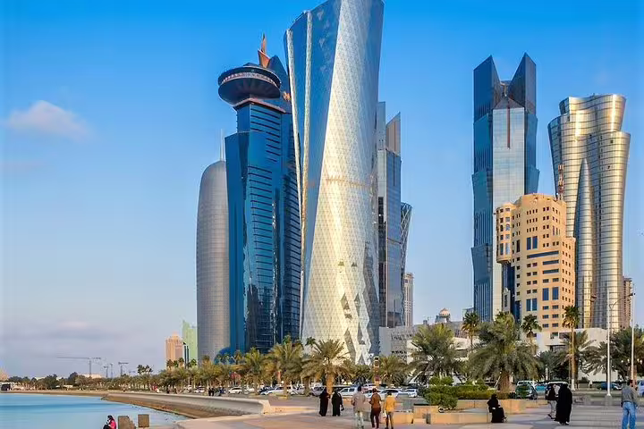 Doha skyline featuring modern skyscrapers along the Corniche, ideal for Hamad Airport transit city tours.