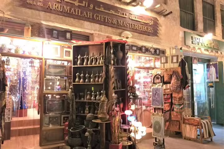 Explore the vibrant Arumailah Gifts shop in Doha's Souq Waqif during a private night city tour.