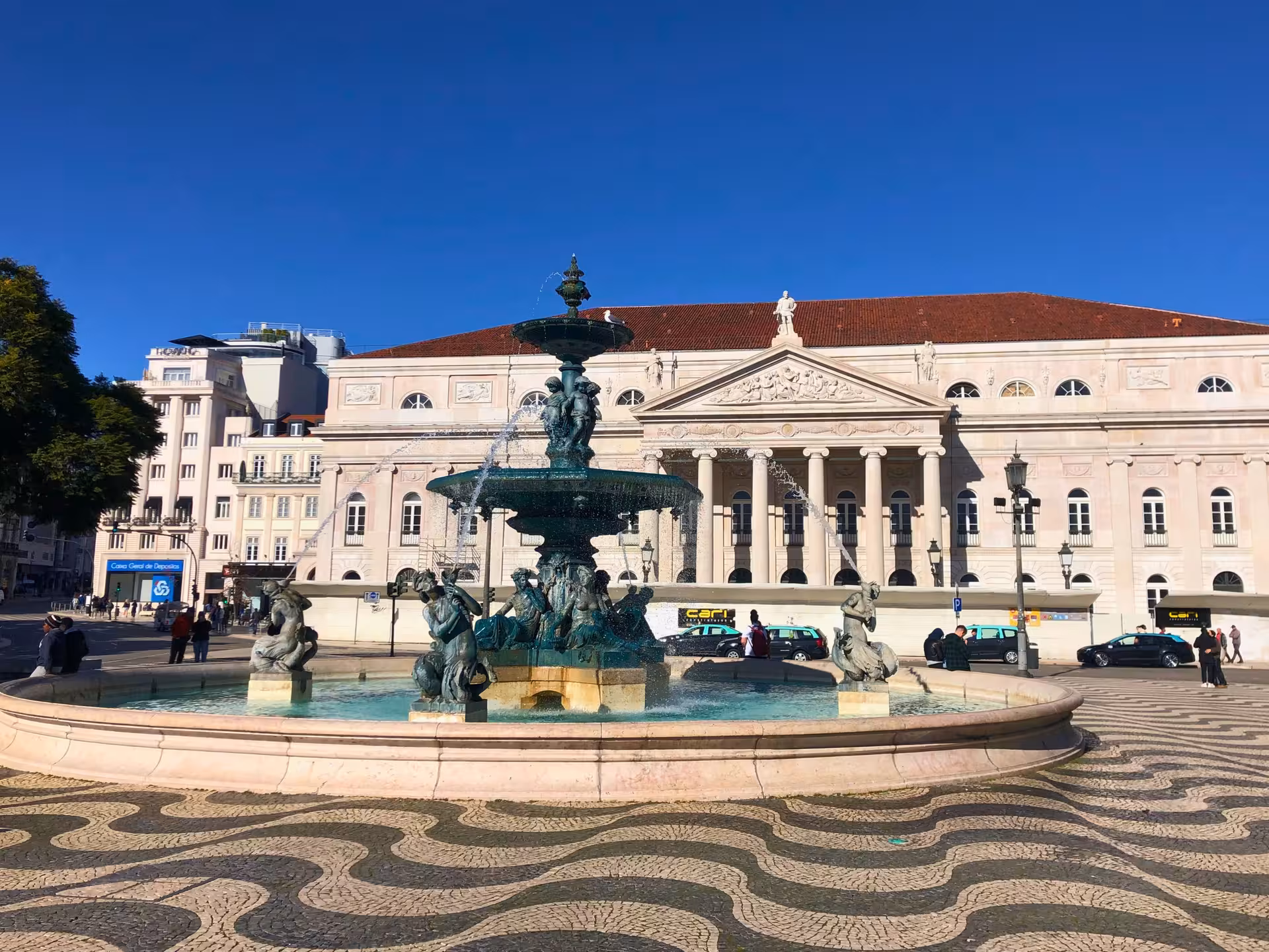 Dom Pedro IV fountain in Rossio Square, Lisbon, iconic landmark featured on the Old Shops, Traditions & Stories tour