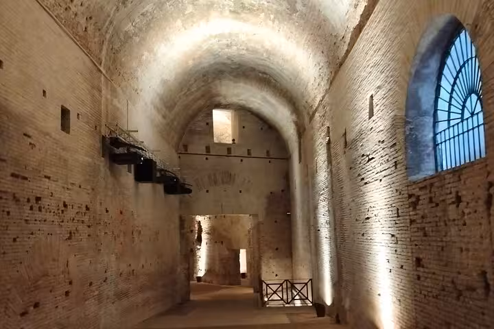 Illuminated ancient corridor within Rome's Domus Aurea, showcasing the grandeur of Emperor Nero's hidden palace.