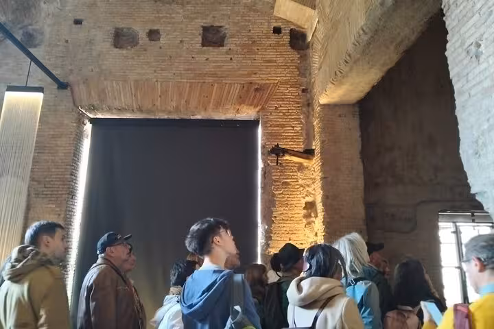 Visitors explore the ancient walls of Rome's Domus Aurea with immersive virtual reality experience.