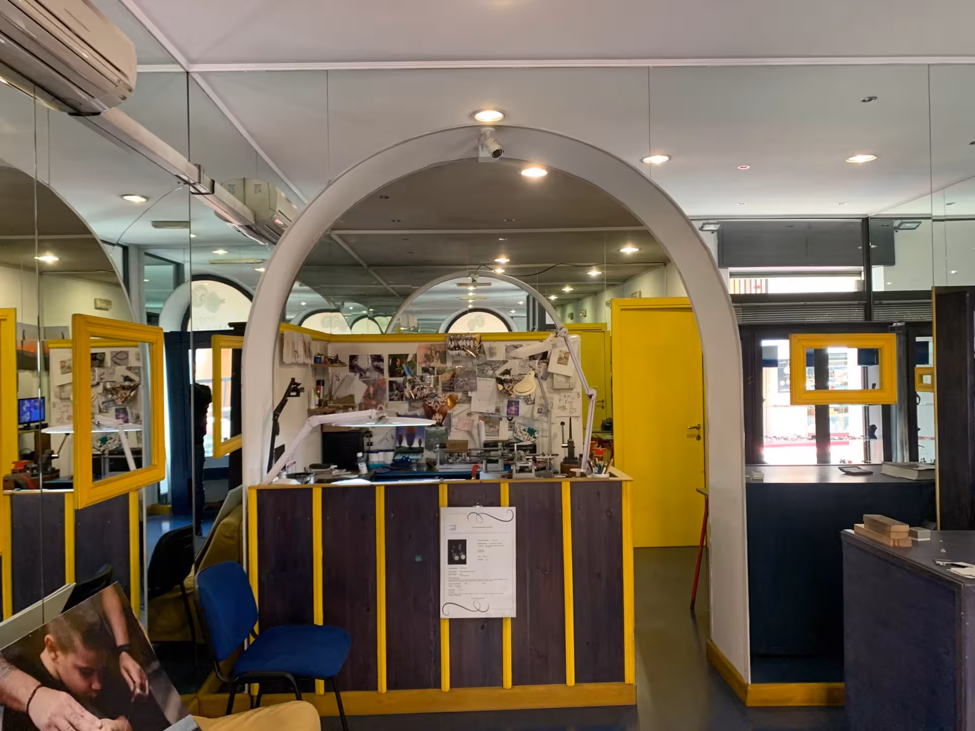 Dorgali goldsmith's studio featuring a central workstation with tools and materials for creating Sardinian filigree jewelry.