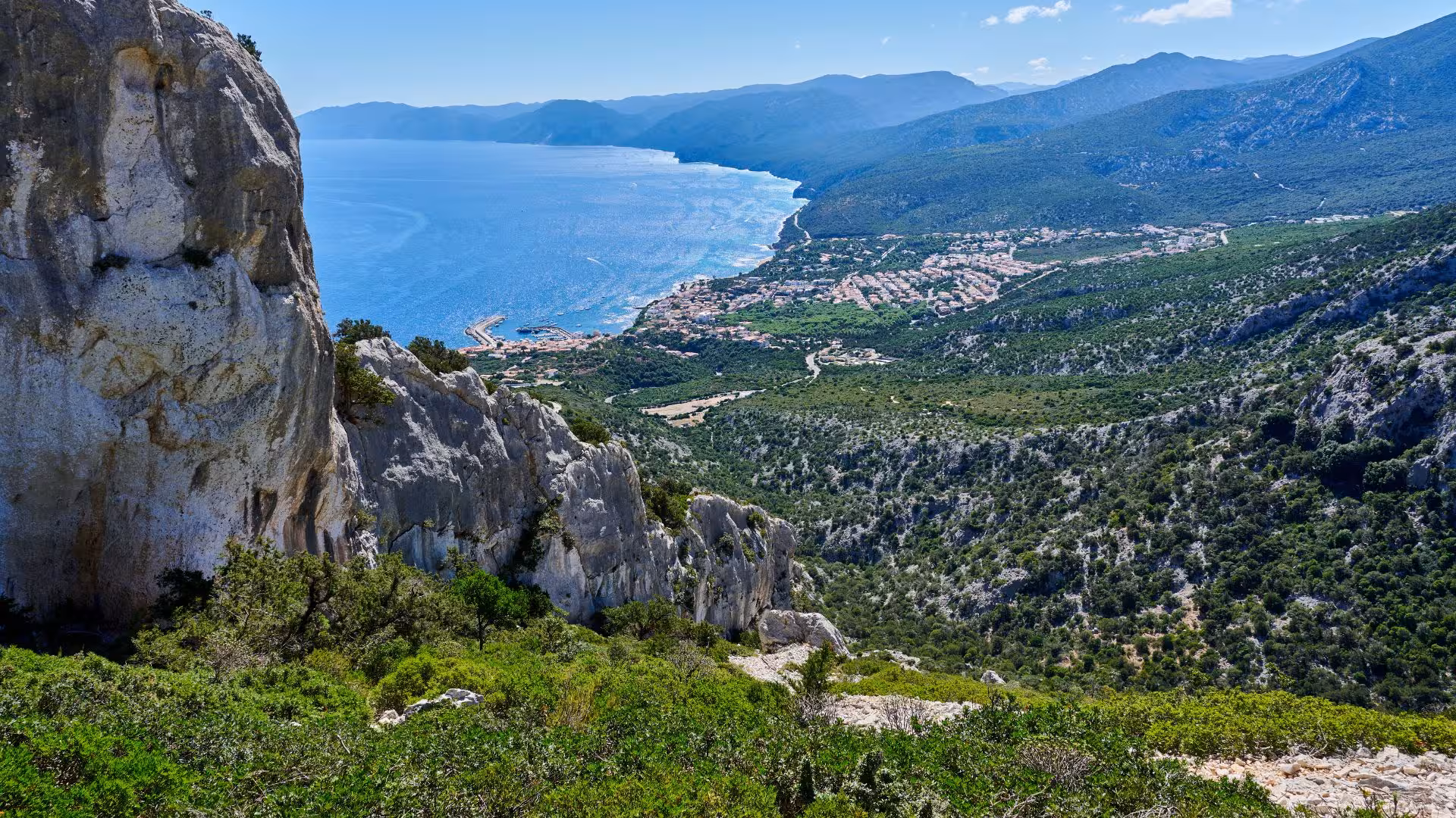 Stunning view of Gulf of Orosei from Dorgali, featuring rugged cliffs and azure waters perfect for horseback tours.