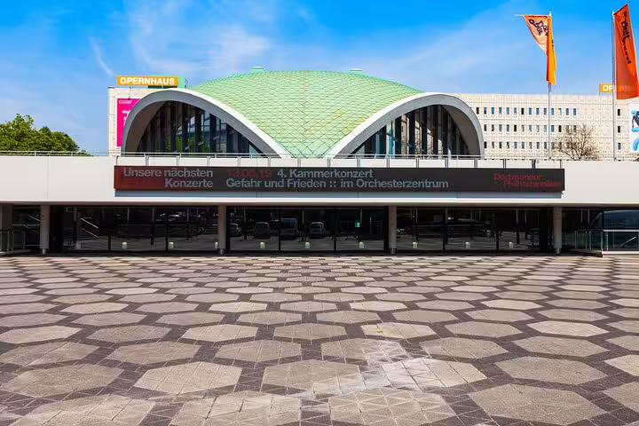 Dortmund Opera House with curved roof and plaza, featured stop on a self-guided scavenger hunt tour