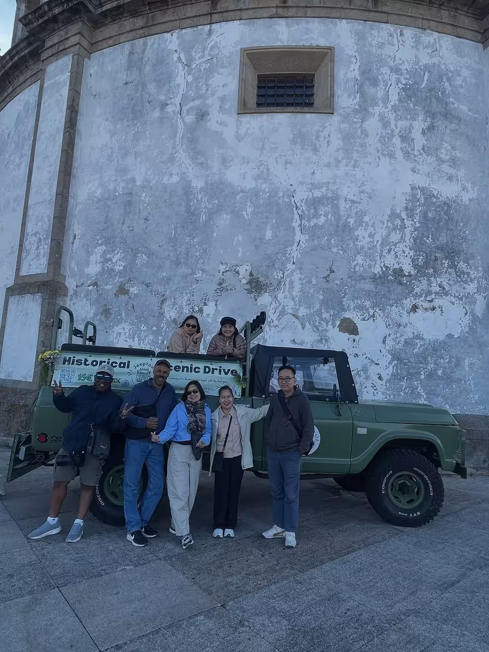 Group photo by vintage 4x4 on Douro River scenic drive, exploring historic mills and hidden gems in Portugal