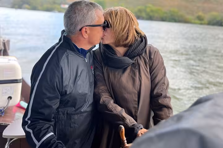 Couple enjoying a private Douro River boat cruise on a Douro Valley tour with guide, wineries and tastings