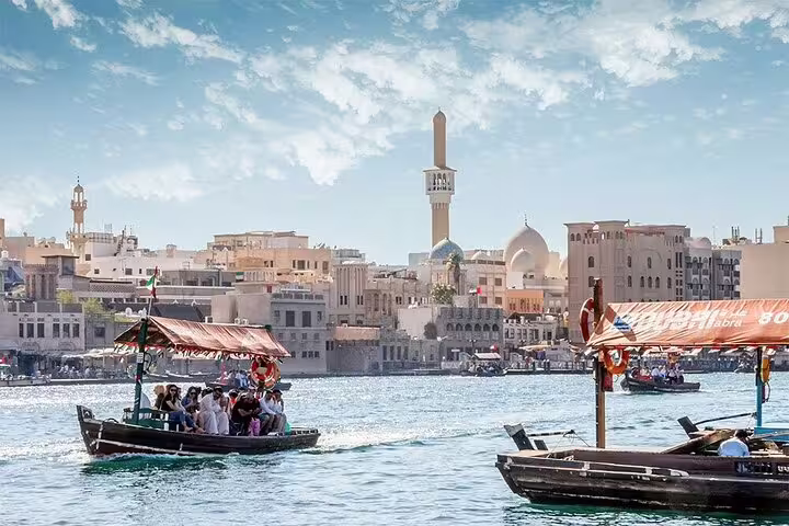 Experience a traditional abra ride with stunning views of Dubai's skyline on a magical day tour.