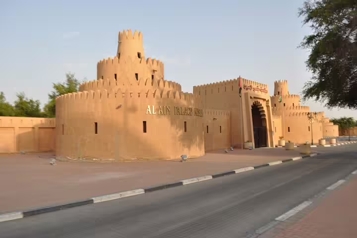 Historic Al Ain Palace Museum under the afternoon sun, highlighting rich cultural experiences in a Dubai private tour.