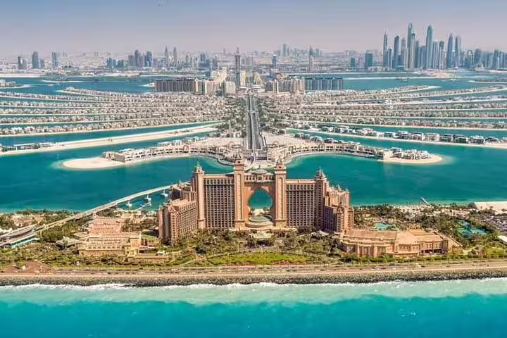 Iconic view of Atlantis, The Palm with surrounding palm-shaped islands, ideal for exploring on a private Dubai tour.