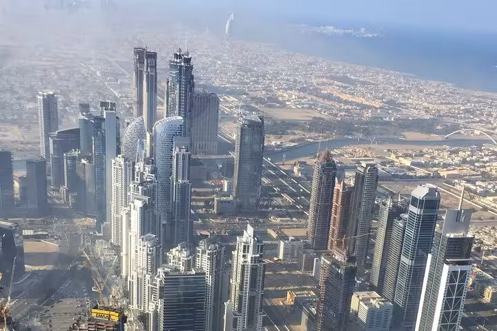 Dubai skyline view from Burj Khalifa observation deck ticket, Downtown towers and coastline panorama